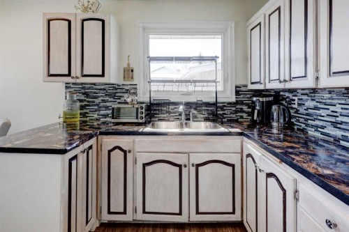 4721 Edmonton Trail Ne, Calgary, AB - Indoor Photo Showing Kitchen With Double Sink