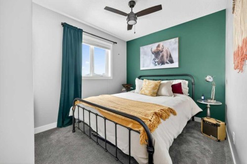 92 Fireside Crescent, Cochrane, AB - Indoor Photo Showing Bedroom