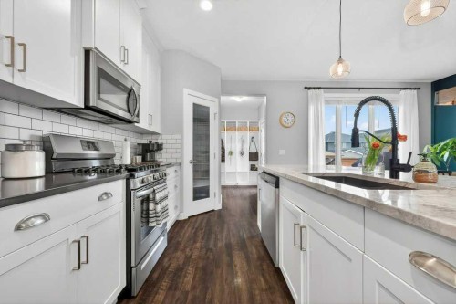 92 Fireside Crescent, Cochrane, AB - Indoor Photo Showing Kitchen With Upgraded Kitchen