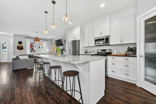 92 Fireside Crescent, Cochrane, AB - Indoor Photo Showing Kitchen With Upgraded Kitchen