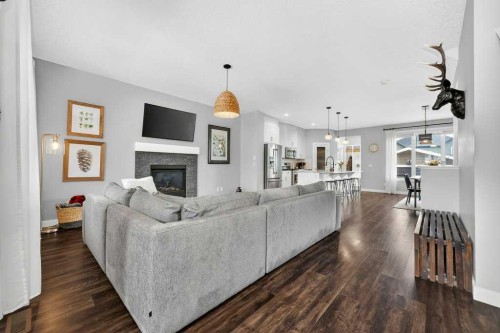 92 Fireside Crescent, Cochrane, AB - Indoor Photo Showing Living Room With Fireplace