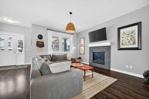 92 Fireside Crescent, Cochrane, AB - Indoor Photo Showing Living Room With Fireplace