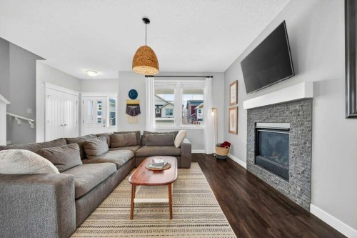 92 Fireside Crescent, Cochrane, AB - Indoor Photo Showing Living Room With Fireplace