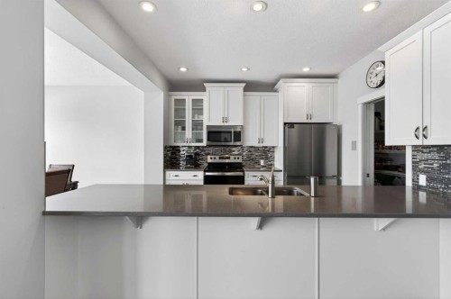 14 Evansfield Road Nw, Calgary, AB - Indoor Photo Showing Kitchen With Stainless Steel Kitchen With Double Sink With Upgraded Kitchen