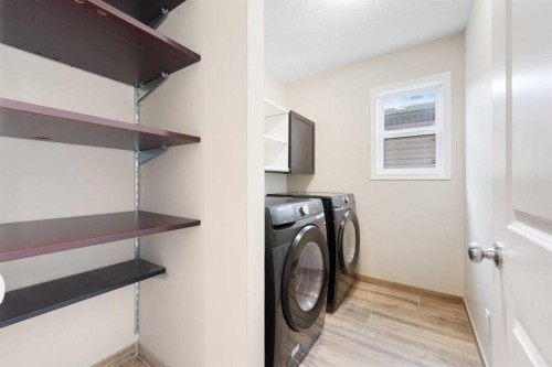 220 Walden Heights Se, Calgary, AB - Indoor Photo Showing Laundry Room