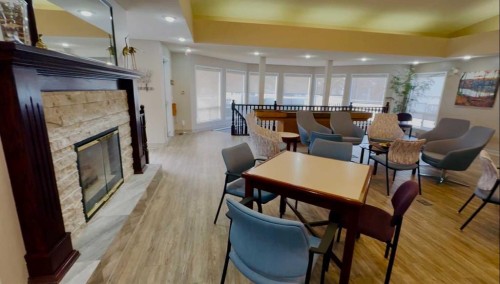 151 Macewan Ridge Villas Nw, Calgary, AB - Indoor With Fireplace