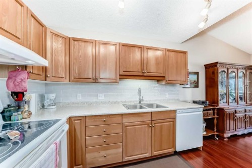 151 Macewan Ridge Villas Nw, Calgary, AB - Indoor Photo Showing Kitchen With Double Sink