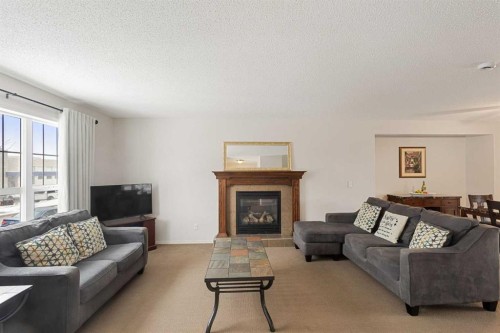41 Silverado Saddle Avenue Sw, Calgary, AB - Indoor Photo Showing Living Room With Fireplace