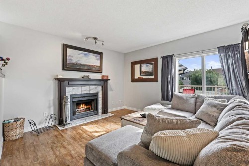 32 Millrise Crescent Sw, Calgary, AB - Indoor Photo Showing Living Room With Fireplace