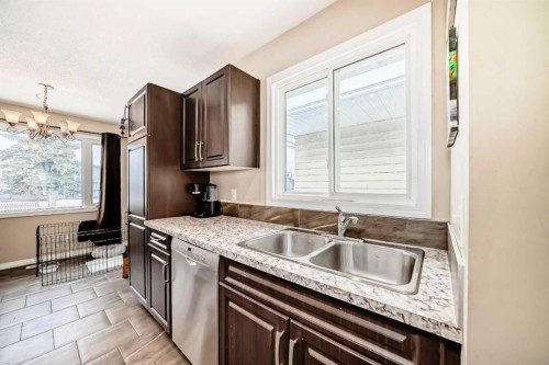 118 Dovertree Place Se, Calgary, AB - Indoor Photo Showing Kitchen With Double Sink