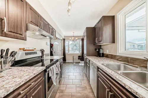 118 Dovertree Place Se, Calgary, AB - Indoor Photo Showing Kitchen With Double Sink