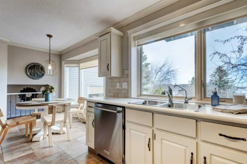 20 Strathlorne Crescent Sw, Calgary, AB - Indoor Photo Showing Kitchen With Double Sink