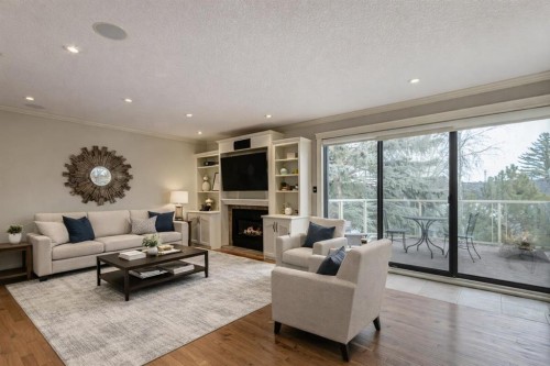 20 Strathlorne Crescent Sw, Calgary, AB - Indoor Photo Showing Living Room With Fireplace