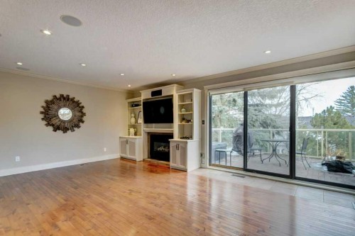 20 Strathlorne Crescent Sw, Calgary, AB - Indoor Photo Showing Other Room With Fireplace