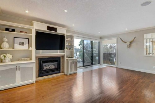 20 Strathlorne Crescent Sw, Calgary, AB - Indoor Photo Showing Living Room With Fireplace