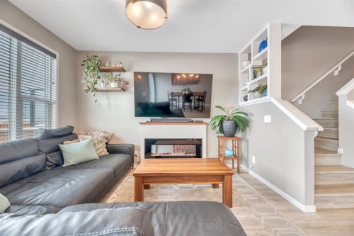 840 Seton Circle Se, Calgary, AB - Indoor Photo Showing Living Room With Fireplace