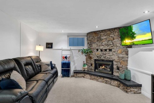 9939 Maplecreek Drive Se, Calgary, AB - Indoor Photo Showing Living Room With Fireplace