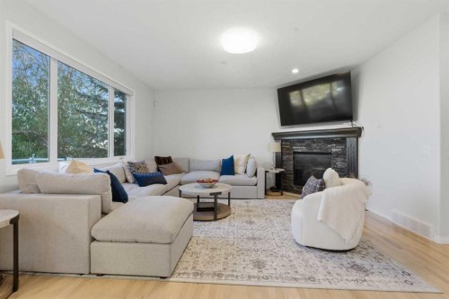 146 Springbluff Heights Sw, Calgary, AB - Indoor Photo Showing Living Room With Fireplace