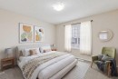 475 Cimarron Boulevard, Okotoks, AB  - Indoor Photo Showing Bedroom 