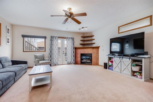 45 Thornfield Close Se, Airdrie, AB - Indoor Photo Showing Living Room With Fireplace