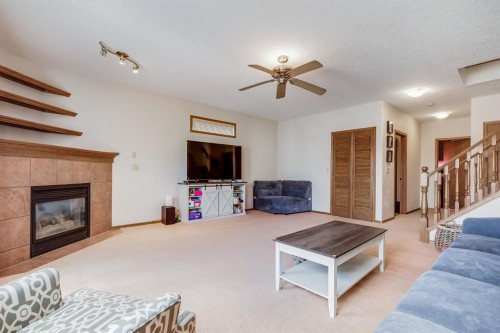 45 Thornfield Close Se, Airdrie, AB - Indoor Photo Showing Living Room With Fireplace