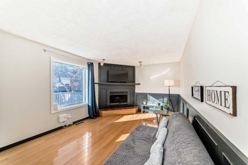 6907 6 Street Sw, Calgary, AB - Indoor Photo Showing Living Room With Fireplace