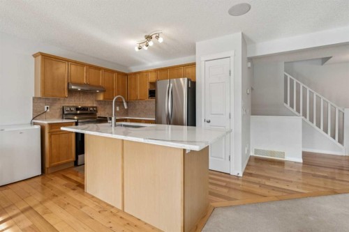 85 Silverado Range View Sw, Calgary, AB - Indoor Photo Showing Kitchen With Stainless Steel Kitchen