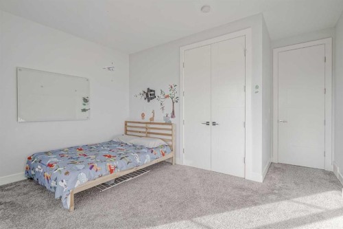 701 13A Street Ne, Calgary, AB - Indoor Photo Showing Bedroom