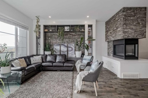 701 13A Street Ne, Calgary, AB - Indoor Photo Showing Living Room With Fireplace