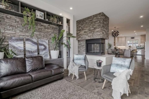 701 13A Street Ne, Calgary, AB - Indoor Photo Showing Living Room With Fireplace