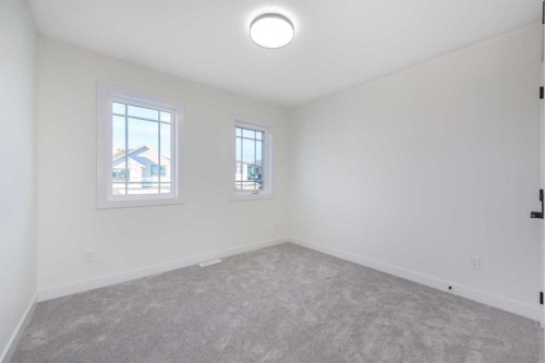 80 Heritage Manor, Cochrane, AB - Indoor Photo Showing Other Room