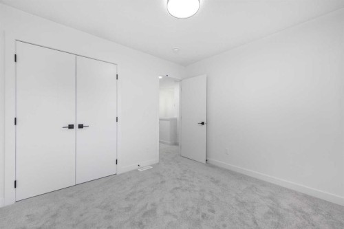 80 Heritage Manor, Cochrane, AB - Indoor Photo Showing Other Room