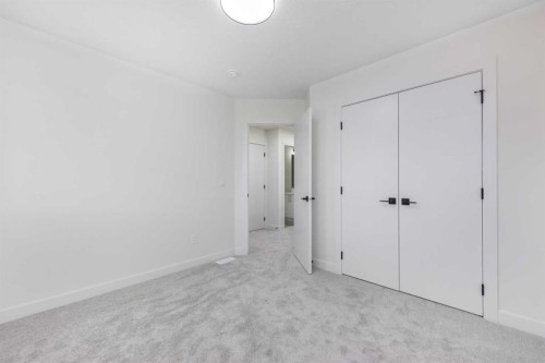 80 Heritage Manor, Cochrane, AB - Indoor Photo Showing Other Room