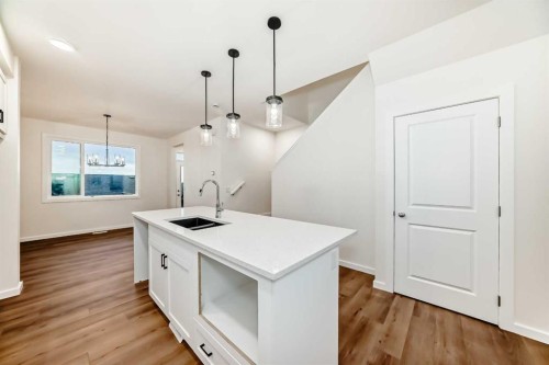 43 Blue Heron Parade Se, Calgary, AB - Indoor Photo Showing Kitchen With Double Sink