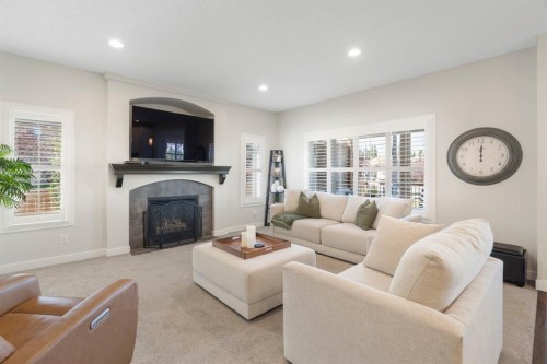 6 Cranwell Square Se, Calgary, AB - Indoor Photo Showing Living Room With Fireplace