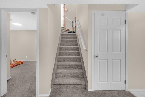 51 Coral Reef Close Ne, Calgary, AB - Indoor Photo Showing Other Room
