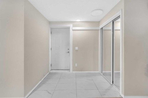 51 Coral Reef Close Ne, Calgary, AB - Indoor Photo Showing Other Room