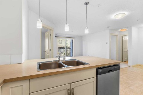 2303-175 Panatella Hill Nw, Calgary, AB - Indoor Photo Showing Kitchen With Double Sink