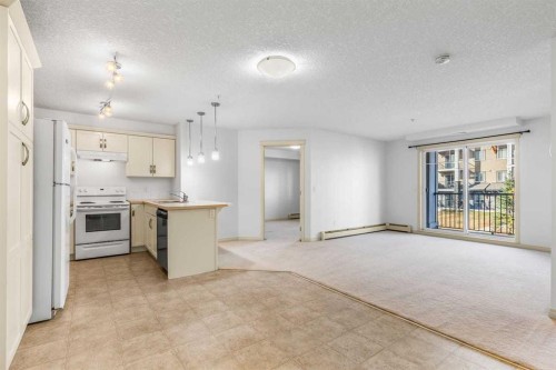 2303-175 Panatella Hill Nw, Calgary, AB - Indoor Photo Showing Kitchen