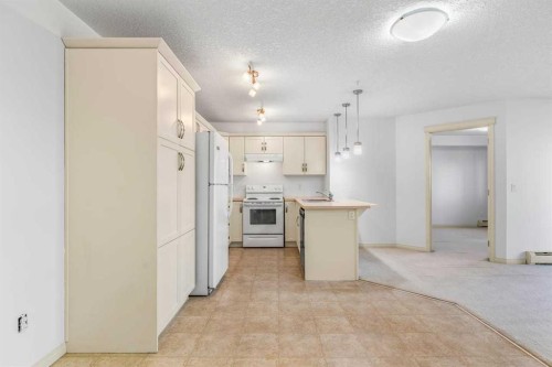 2303-175 Panatella Hill Nw, Calgary, AB - Indoor Photo Showing Kitchen