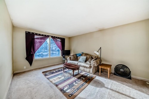 247 Bracewood Road Sw, Calgary, AB - Indoor Photo Showing Living Room