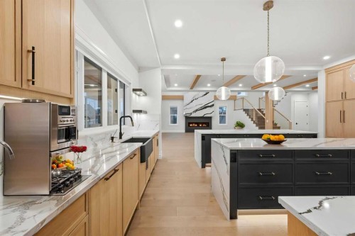 126 Sunstone Way, Balzac, AB - Indoor Photo Showing Kitchen With Upgraded Kitchen