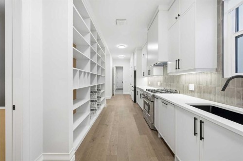 126 Sunstone Way, Balzac, AB - Indoor Photo Showing Kitchen With Upgraded Kitchen