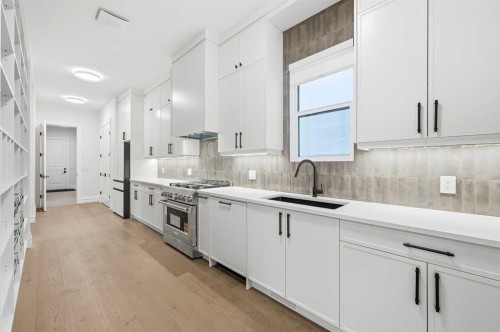 126 Sunstone Way, Balzac, AB - Indoor Photo Showing Kitchen With Upgraded Kitchen