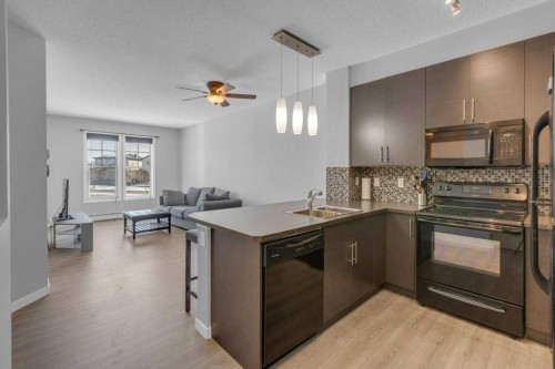 207-207 Sunset Drive, Cochrane, AB - Indoor Photo Showing Kitchen