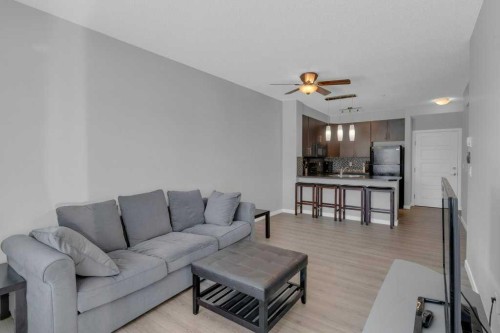 207-207 Sunset Drive, Cochrane, AB - Indoor Photo Showing Living Room