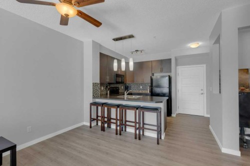 207-207 Sunset Drive, Cochrane, AB - Indoor Photo Showing Kitchen