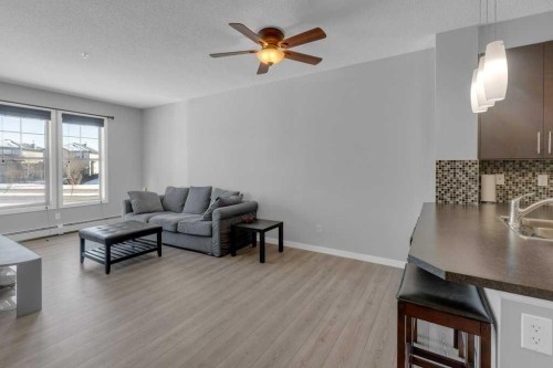 207-207 Sunset Drive, Cochrane, AB - Indoor Photo Showing Living Room