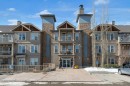 207-207 Sunset Drive, Cochrane, AB  - Outdoor With Facade 