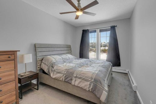 207-207 Sunset Drive, Cochrane, AB - Indoor Photo Showing Bedroom